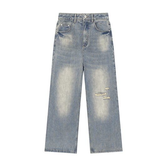 Unisex vintage wash distressed denim jeans from ODMPOD featuring a relaxed fit and faded, worn-in look.